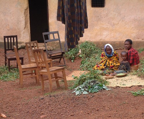 She sat in front of her quite large and well-built house when we came by... Muramvia, Burundi © 2007 Jan Oberg, TFF