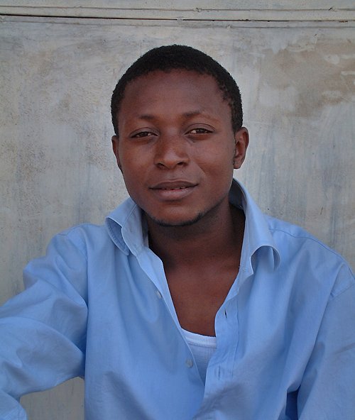 Young man posing in the street. Bujumbura, Burundi # 2 © 2006 Jan Oberg, TFF