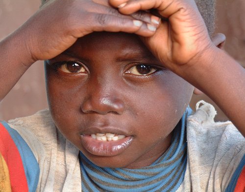 Shy little boy in Gitega, Burundi © 2006 Jan Oberg, TFF