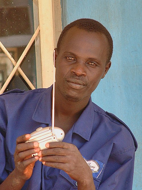 Guards outside a shop. Bujumbura, Burundi # 3 © 2006 Jan Oberg, TFF Back to the series "Bujumbura, Burundi"