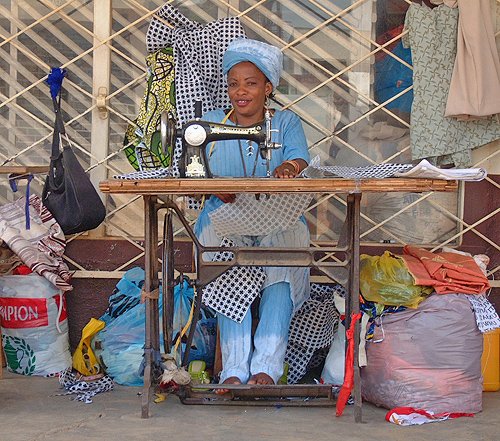 Woman sewing in the street. Bujumbura, Burundi # 1 © 2006 Jan Oberg, TFF